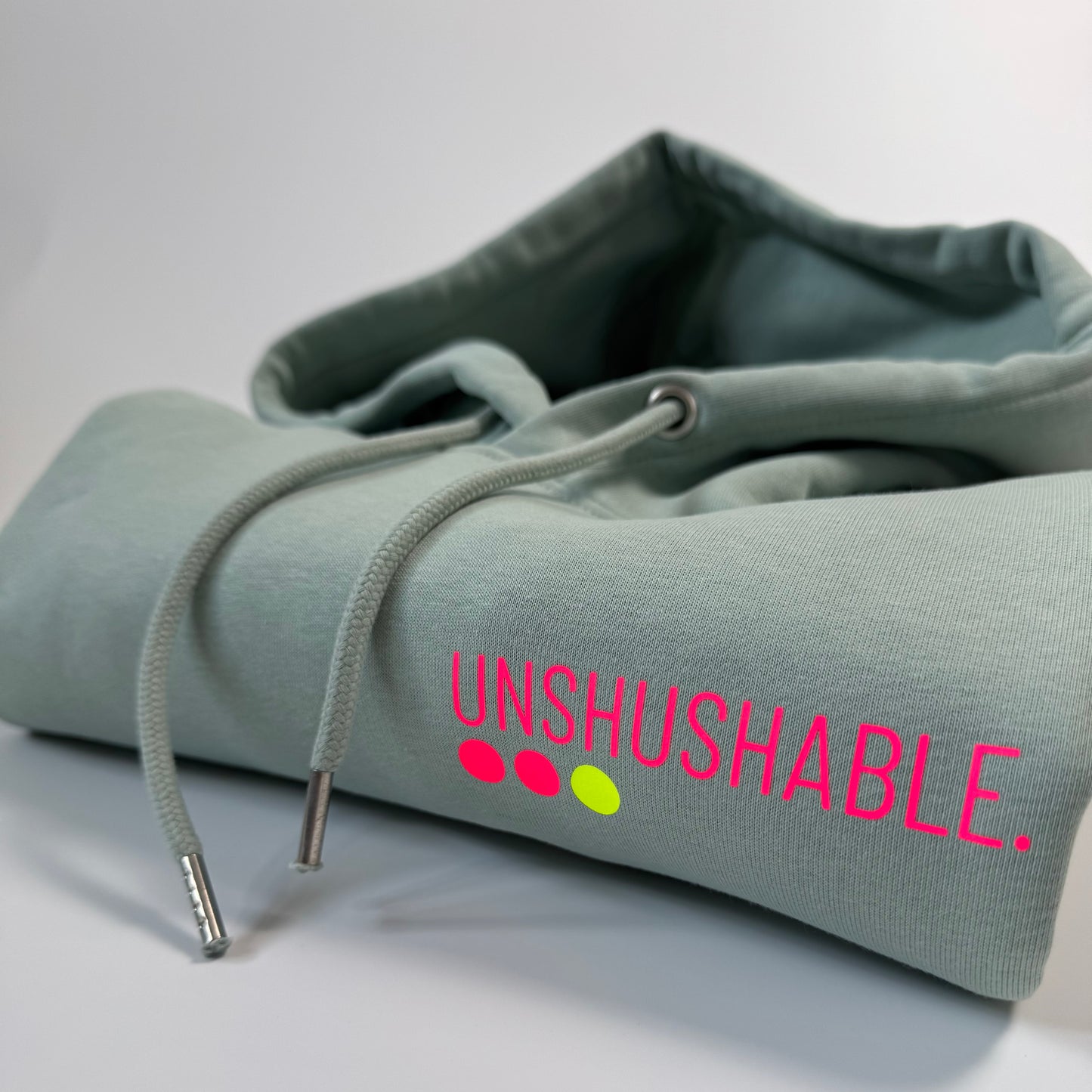 Hoodie Unisex 'Unshushable / Unüberhörbar.': Senf, Aloe / Neon Pink