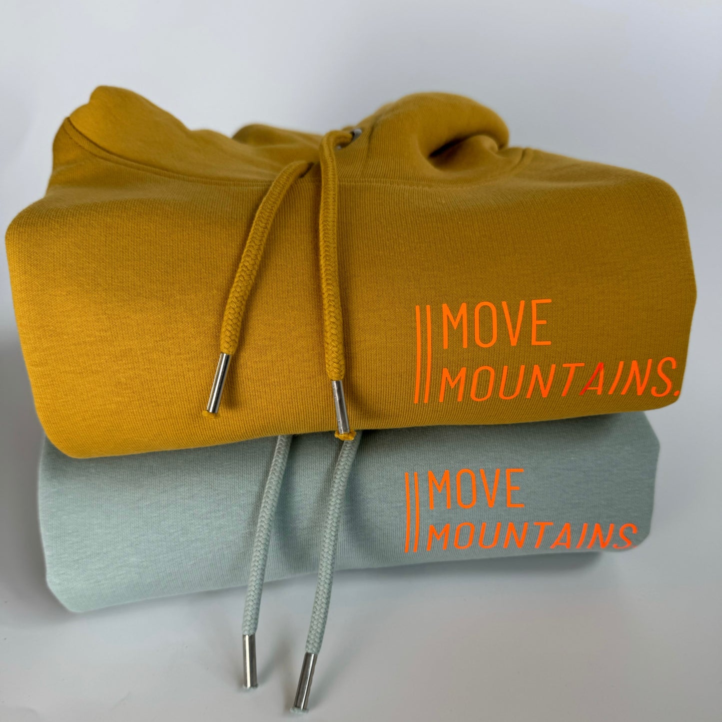 Hoodie Unisex 'Move Mountains.': Senf, Aloe / Neon Orange
