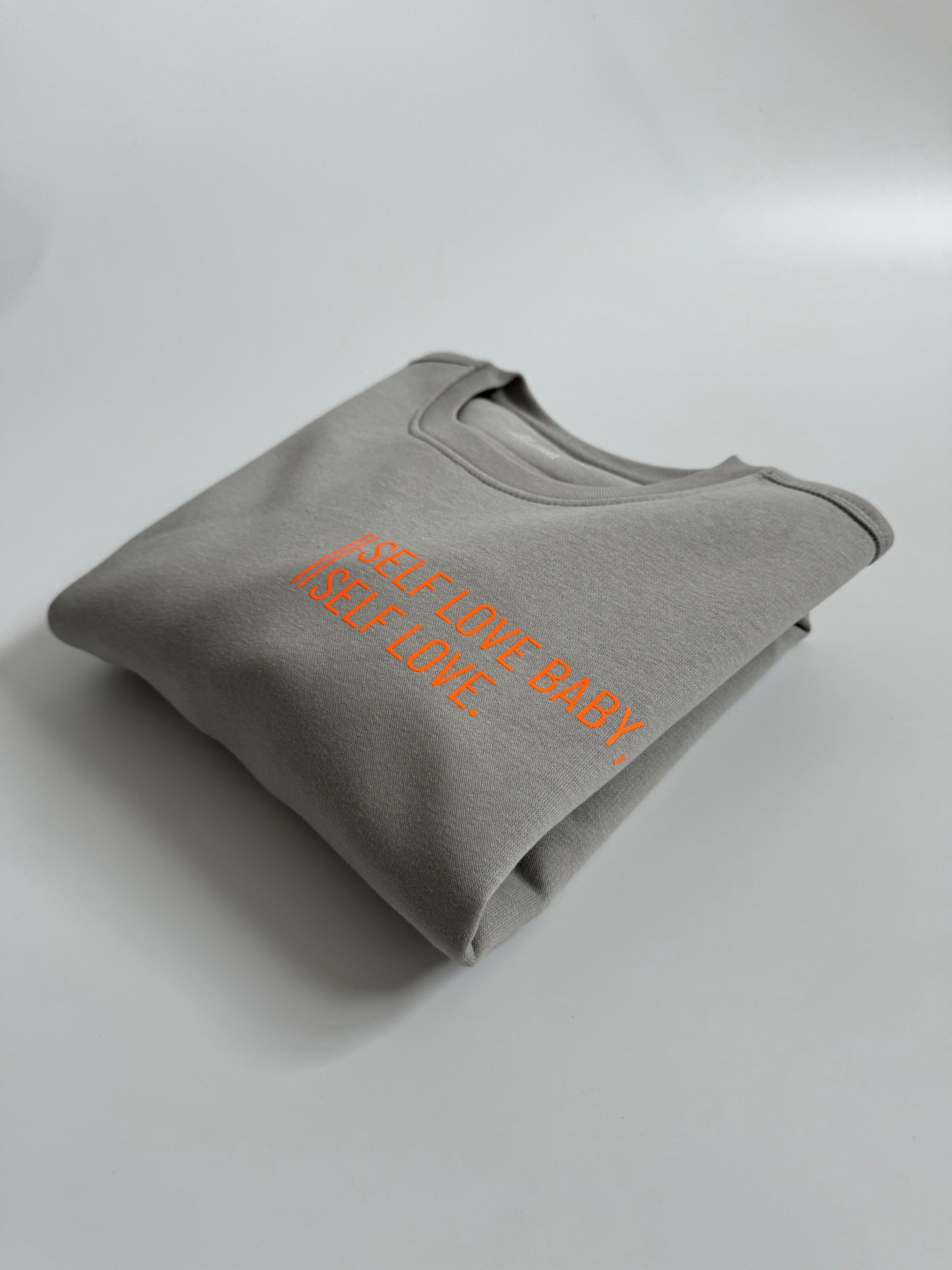 Sweatshirt Unisex 'Self love baby, self love.': Opal Grau / Neon Orange