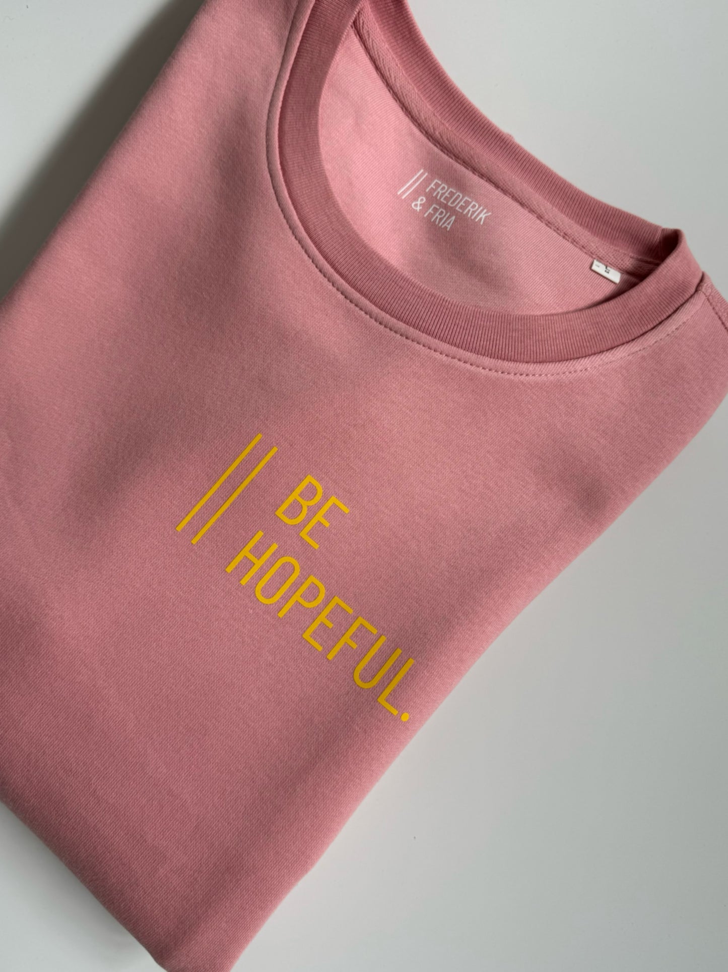 Sweatshirt Unisex 'Be hopeful.': Canyon Pink / Gelb