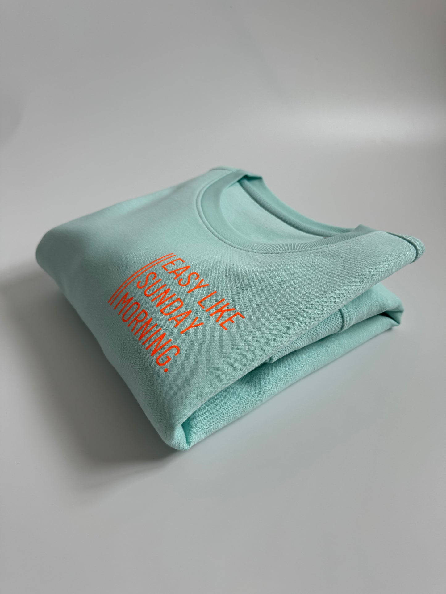 Sweatshirt Unisex 'Easy like Sunday morning.': Caribean Blue / Neon Orange