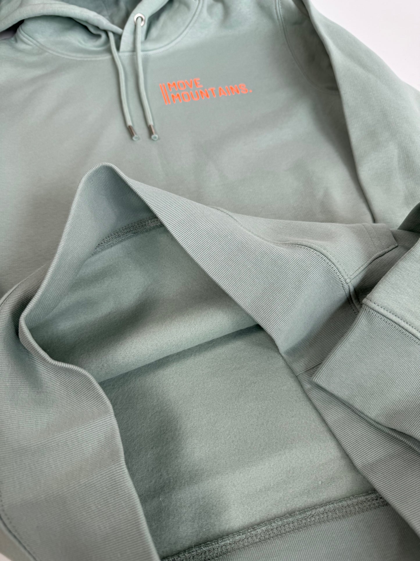Hoodie Unisex 'Move Mountains.': Senf, Aloe / Neon Orange