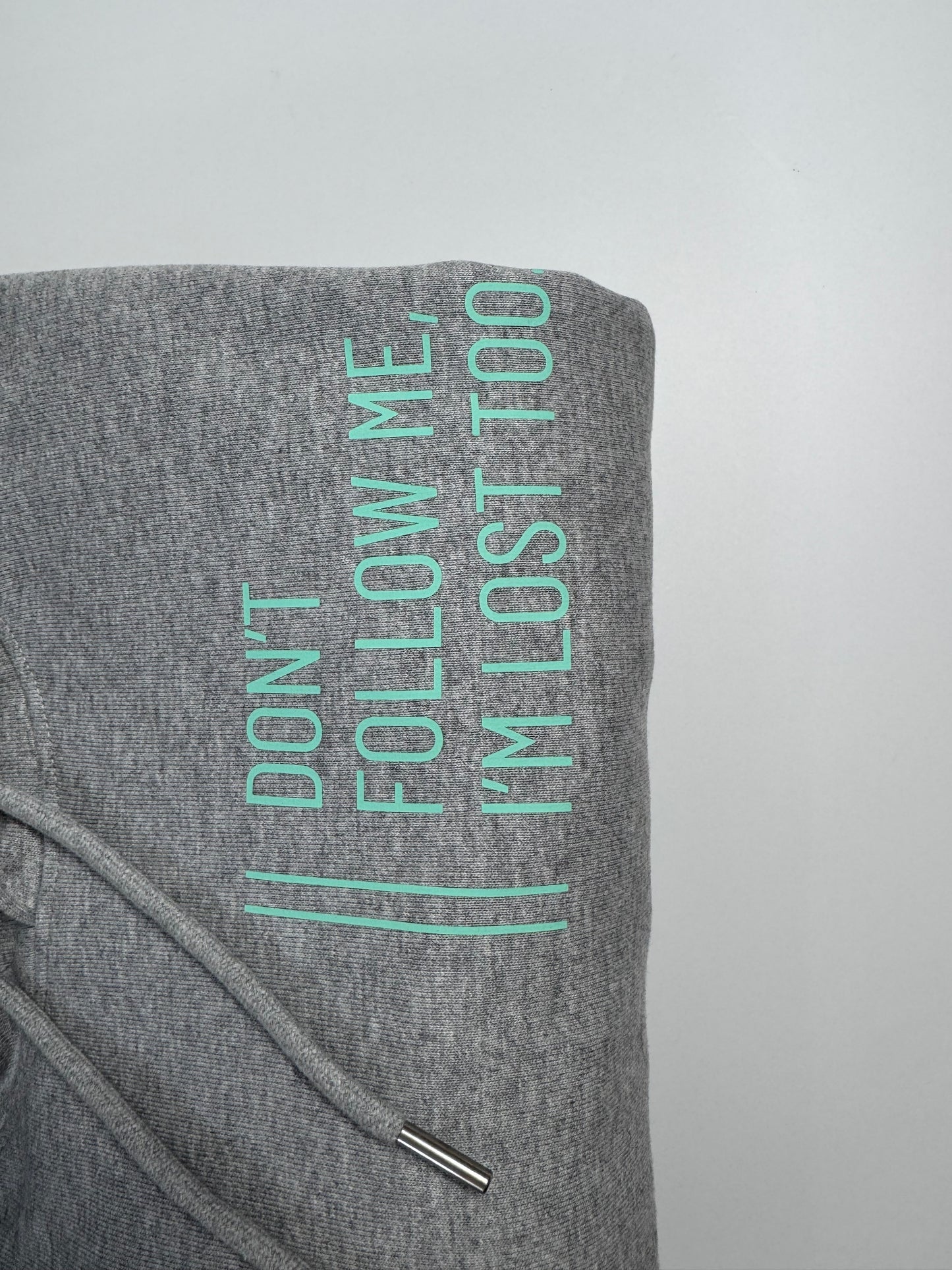 Hoodie Unisex 'Don’t follow me, I’m lost too.': Heather Grey / Blass Türkis