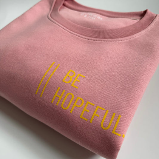 Sweatshirt Unisex 'Be hopeful.': Canyon Pink / Gelb