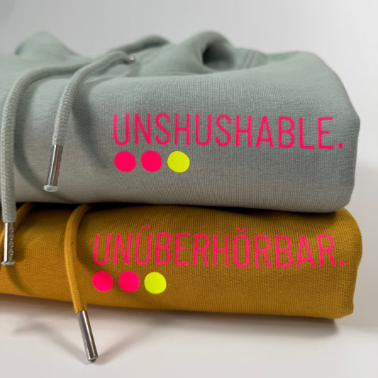 Hoodie Unisex 'Unshushable / Unüberhörbar.': Senf, Aloe / Neon Pink