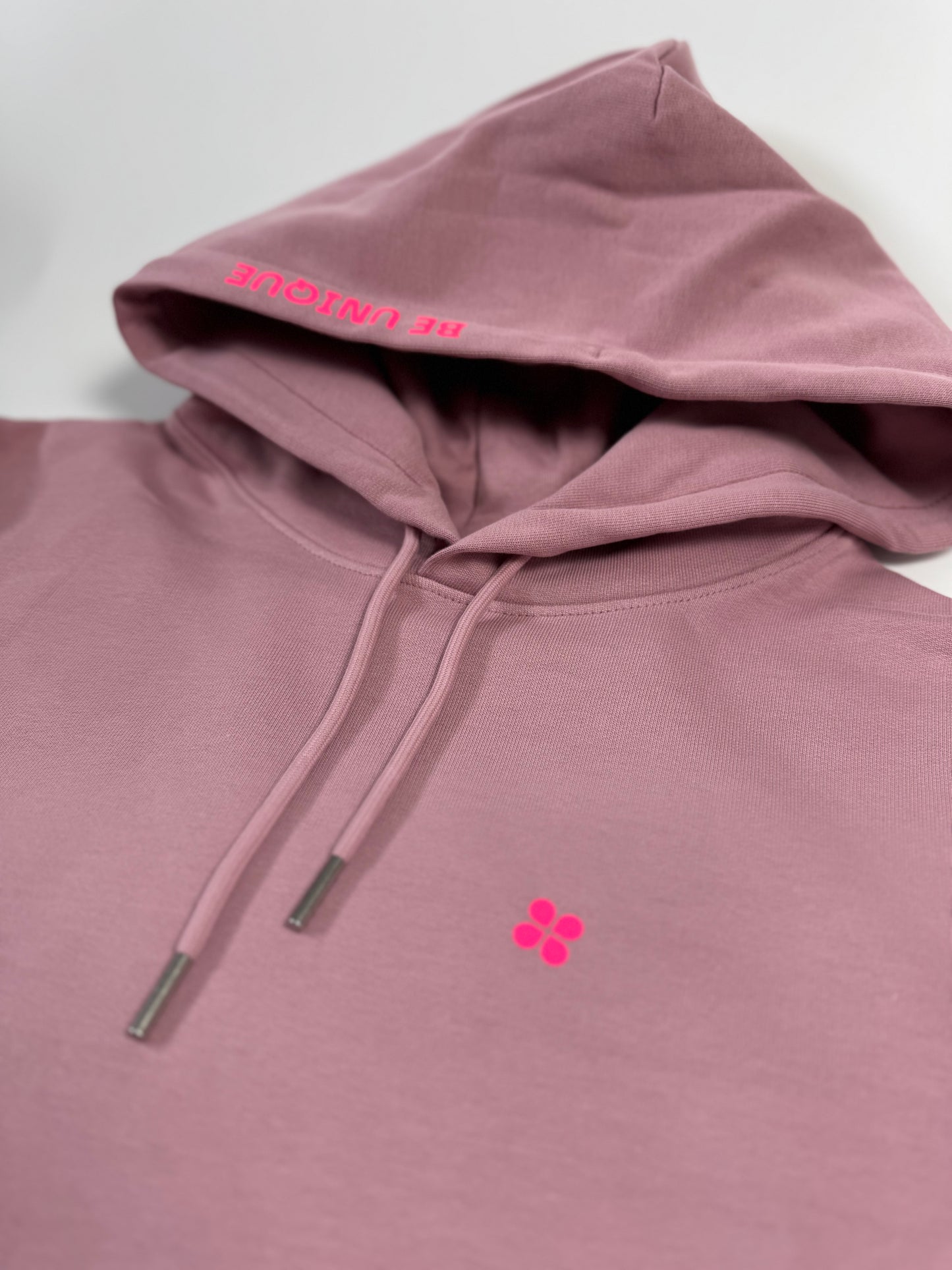 Hoodie Unisex 'Be unique.': Rosalila / Neon Pink